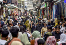 Shoppers throng markets in large numbers ahead of Eid Shoppers throng a local market in Srinagar on Tuesday. -Excelsior/Shakeel
