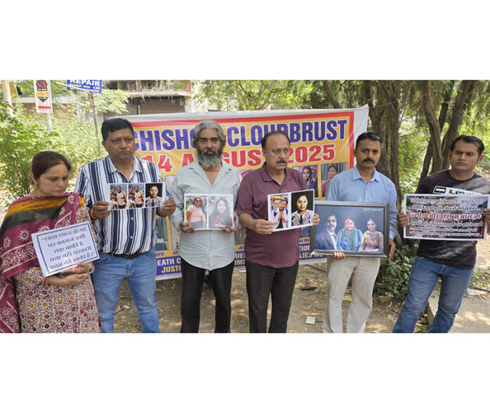 Family members of missing Chashoti cloudburst victims staging protest near Press Club in Jammu on Friday. -Excelsior/ Rakesh