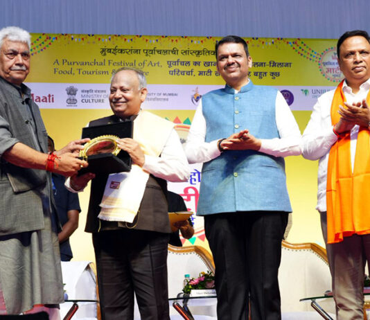LG felicitating a personality in Mumbai on Saturday.