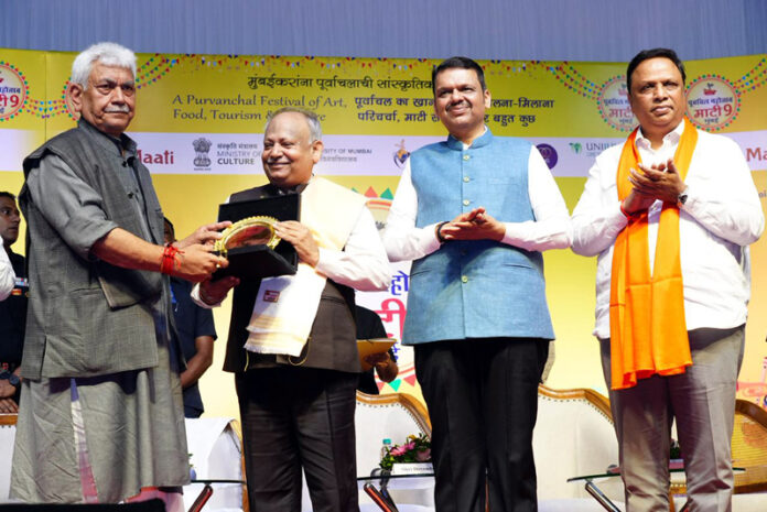 LG felicitating a personality in Mumbai on Saturday. LG felicitating a personality in Mumbai on Saturday.