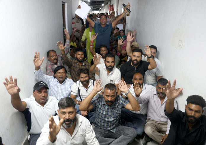 Jammu Municipal Workers Union raising slogans during a protest demonstration in Jammu on Tuesday. -Excelsior/Rakesh Jammu Municipal Workers Union raising slogans during a protest demonstration in Jammu on Tuesday. -Excelsior/Rakesh