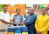 BJP J&K UT president and MP, Sat Sharma receiving books on Dr Ambedkar from party vice president, Bharat Bushan at Jammu on Sunday.