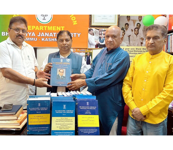 BJP J&K UT president and MP, Sat Sharma receiving books on Dr Ambedkar from party vice president, Bharat Bushan at Jammu on Sunday. BJP J&K UT president and MP, Sat Sharma receiving books on Dr Ambedkar from party vice president, Bharat Bushan at Jammu on Sunday.