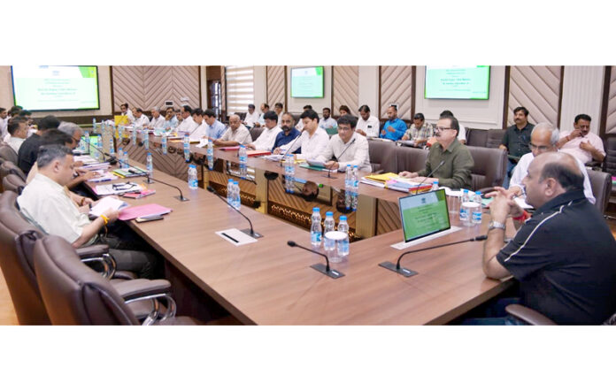 Deputy Chief Minister chairing a meeting at Jammu on Sunday.
