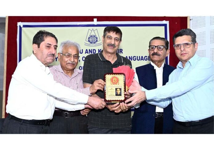 Well known scholar, Prof Rattan Talashi being honoured at Jammu on Friday.