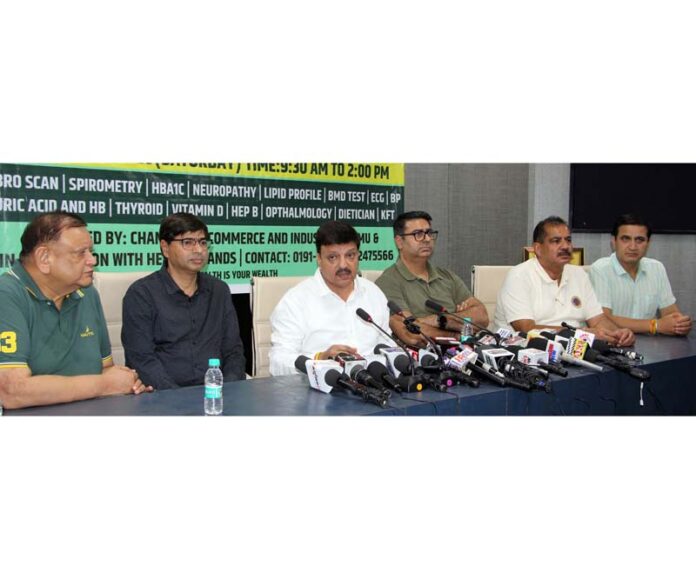 CCI president, Arun Gupta, flanked by others, talking to media-persons in Jammu on Friday. -Excelsior/Rakesh