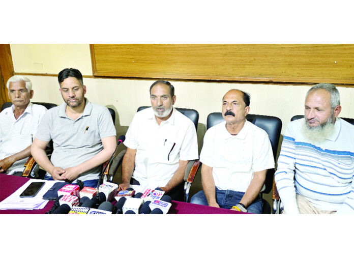 INTUC Sevadal Chairman, Faiz Ahmed Chouhan addressing press conference in Jammu. -Excelsior/Rakesh