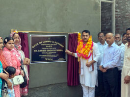 MLA R S Pathania unveiling a foundation stone at Majalta.