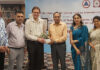 Organizers presenting a memento to chief guest during CME.