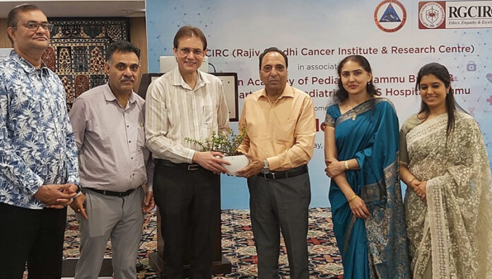 Organizers presenting a memento to chief guest during CME.