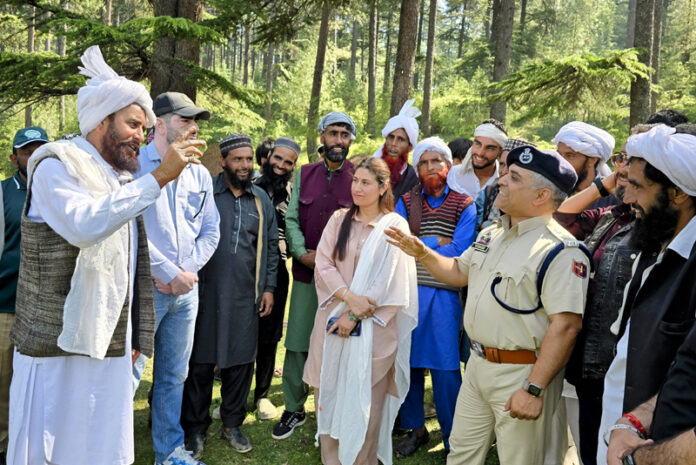 Members of tribal community and others during a meeting in Bhaderwah on Sunday. -Excelsior/Tilak Raj