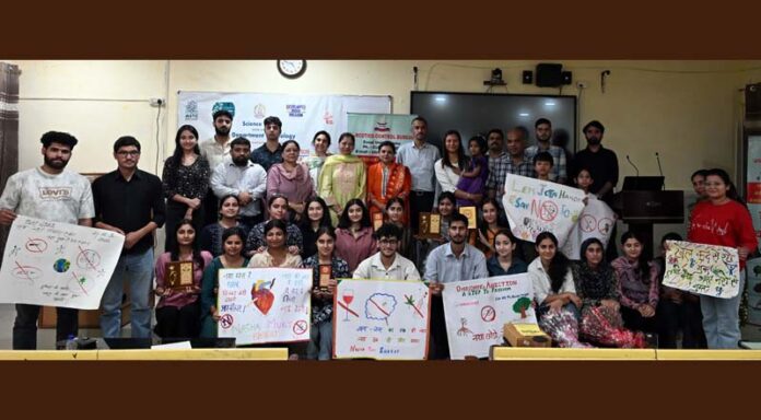 Participating students display posters carrying anti-drug messages during awareness programme at JU on Friday.