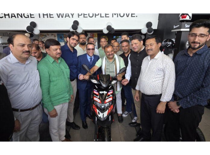 MLA Bahu Vikram Randhawa unveiling Aprilia scooter at Rising Autoz Private Limited, Jammu. -Excelsior/Rakesh