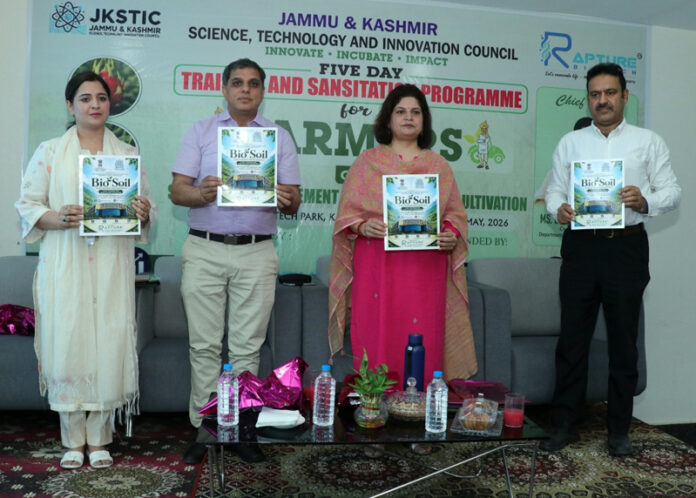 Babila Rakwal and others releasing a souvenir during launch of training program at Industrial Biotech Park.