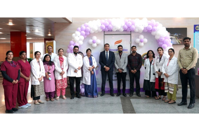Officials of Himalaya Wellness and faculty members of AIIMS Jammu posing together during donation of feeding pods in the Institute.