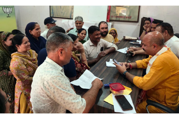 MLA, Yudhvir Sethi listening public grievances in Jammu on Thursday.