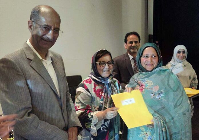 Minister Sakeena Itoo giving appointment letter to CPW at Srinagar on Tuesday.