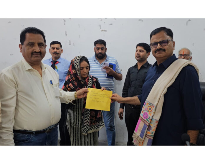 Minister Javed Rana handing over engagement orders to Anganwadi Workers and Helpers on Monday.