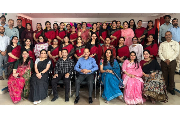 Delhi Public School Nagbani faculty members posing along with resource persons during a programme.