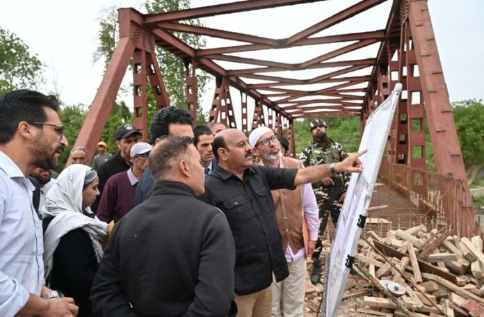 DyCM inspecting work on a bridge in Zainapora Constituency on Monday.