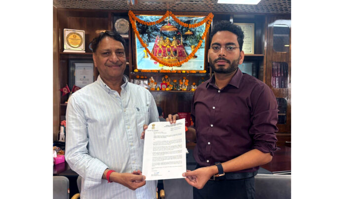 MLA Baldev Raj Sharma presenting a memorandum to CEO SMVDSB Sachin Kumar Vaishya.