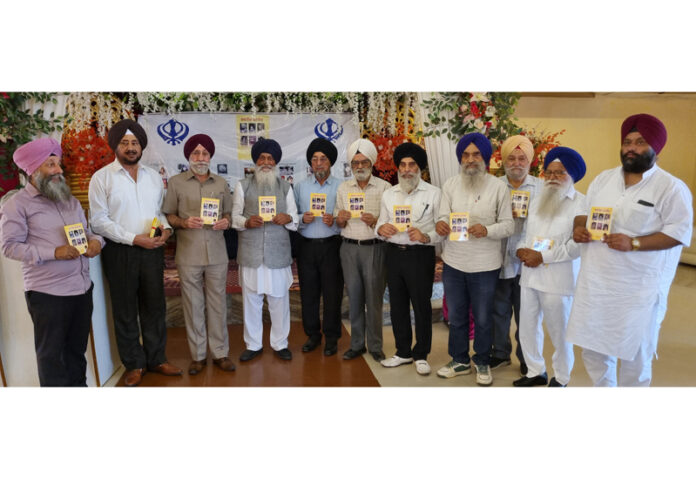A Punjabi book being released during a function at Chatha in Jammu.