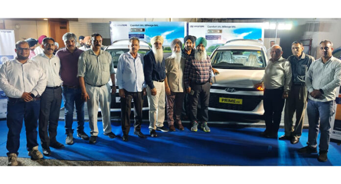 Officials of AM Hyundai posing along with the members of Taxi Association in Jammu. Officials of AM Hyundai posing along with the members of Taxi Association in Jammu.