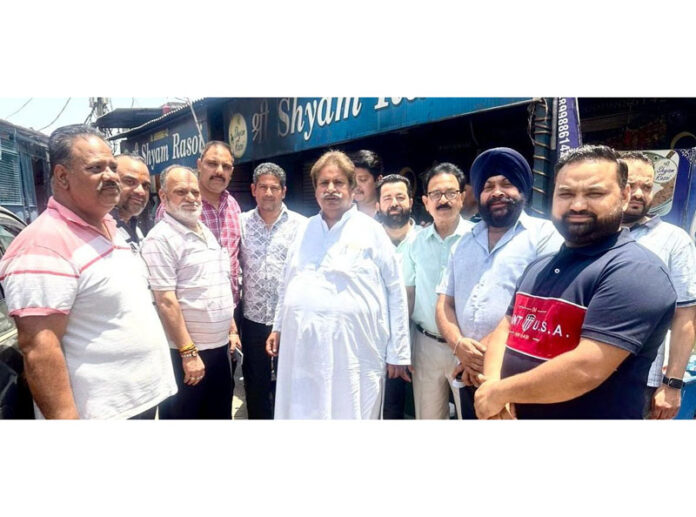 JKPCC president Raman Bhalla posing for a photograph with public at Channi Himmat in Jammu on Thursday. JKPCC president Raman Bhalla posing for a photograph with public at Channi Himmat in Jammu on Thursday.