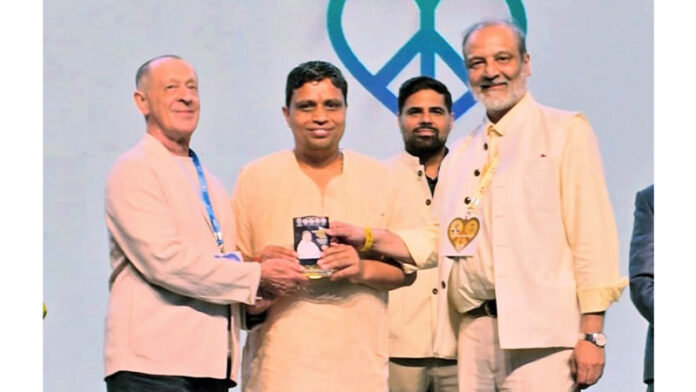 Acharya Balkrishna receiving an award during a function on Thursday.