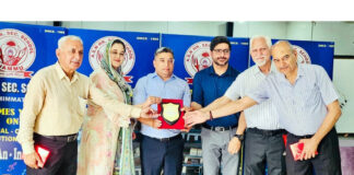 School Management presenting memento to dignitary during a programme.
