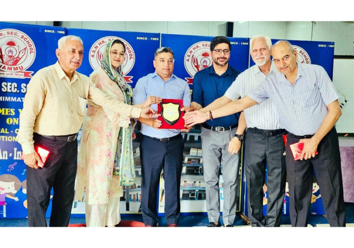 School Management presenting memento to dignitary during a programme.