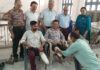 People getting free artificial limbs at a camp.