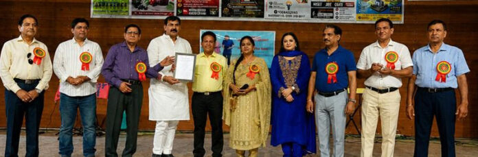 MLA Arvind Gupta posing along with others during a function in Jammu.