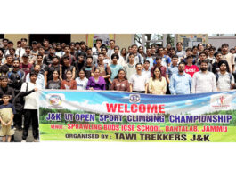 Sport Climbers posing along with dignitaries during an event.