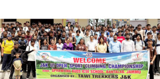 Sport Climbers posing along with dignitaries during an event.
