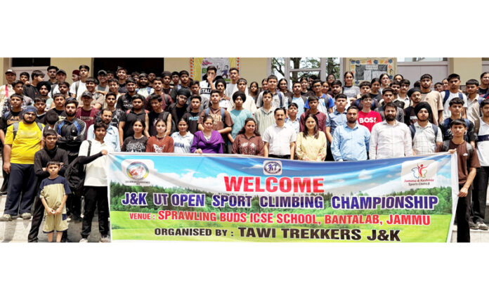 Sport Climbers posing along with dignitaries during an event.