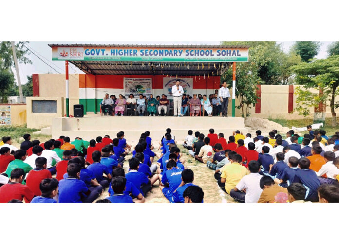 Dignitaries interacting with participants during an inter-school zonal level competition in Akhnoor.