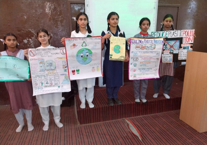Students posing with posters during a programme. Students posing with posters during a programme.