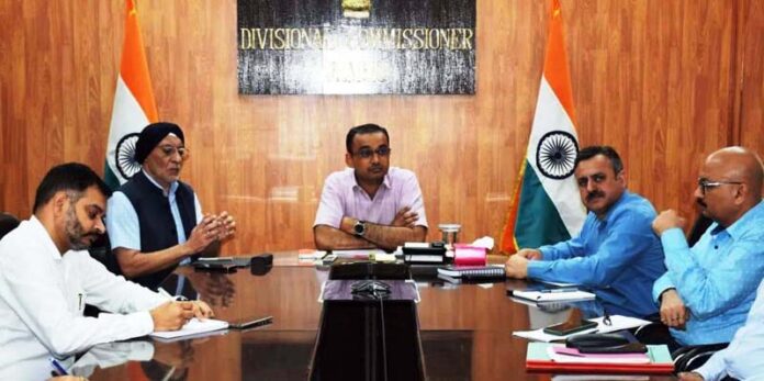 Div Com chairing a meeting at Jammu on Tuesday.