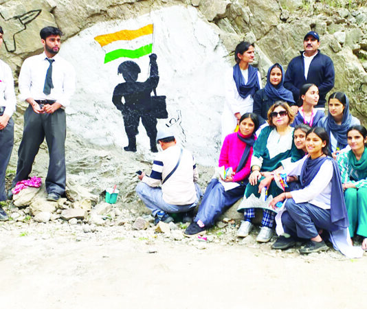 Students and others during an Art Workshop in Kishtwar on Monday.