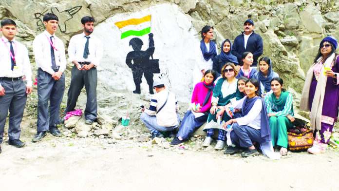 Students and others during an Art Workshop in Kishtwar on Monday.