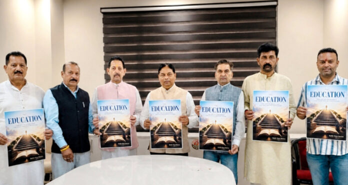 BJP leaders unveiling cover page of Balbir Ram’s book at Jammu on Tuesday.