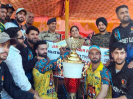 Winning team alongwith dignitaries posing with the trophy during a programme —Excelsior/Tilak Raj