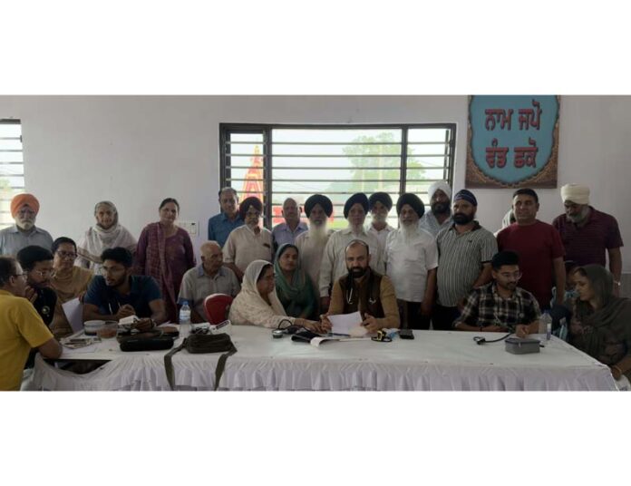 Dr Sushil Sharma and his team giving their services during a health check-up camp.
