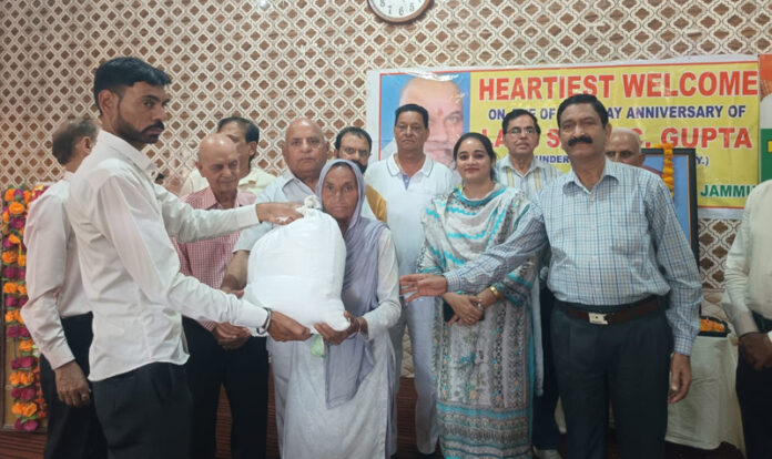 Members of Tawi Welfare Society distributing ration kits among beneficiaries.