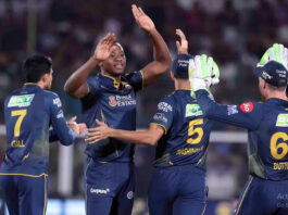 Gujarat Titans player celebrating with teammates after taking a wicket against RR in Jaipur on Saturday.