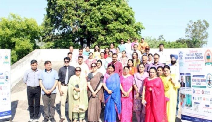 Resource persons with the participants of faculty orientation workshop posing for a group photograph at GCW Gandhinagar. Resource persons with the participants of faculty orientation workshop posing for a group photograph at GCW Gandhinagar.
