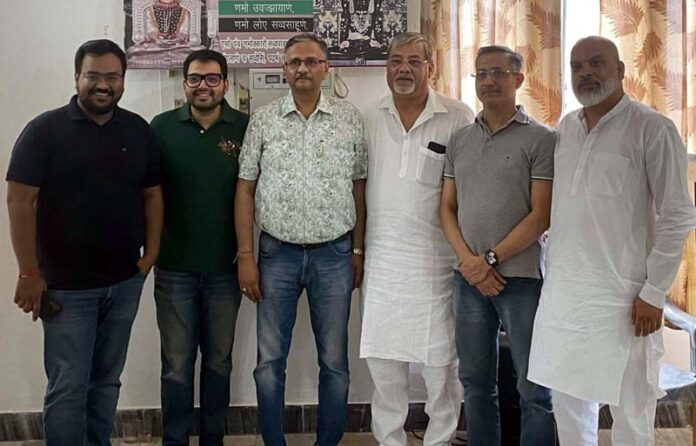 Atmanand Jain Sabha office bearers posing for a photograph after elections.