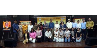 Dignitaries posing along with winners during a debate competition at Jammu University.