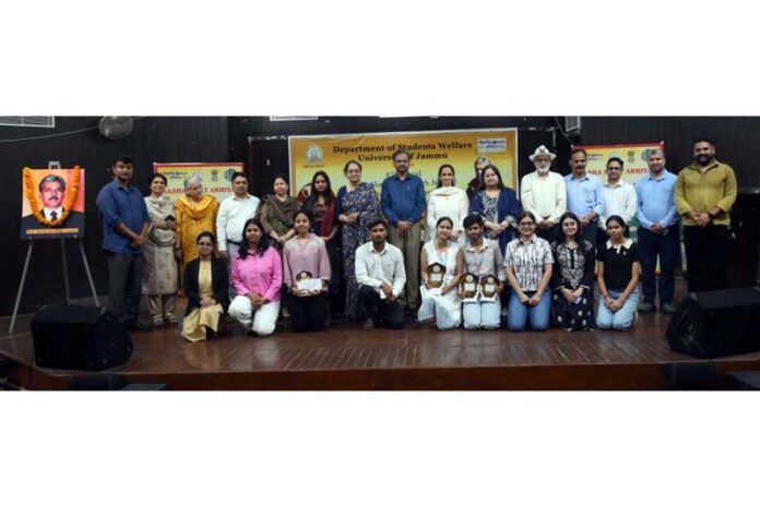 Dignitaries posing along with winners during a debate competition at Jammu University.